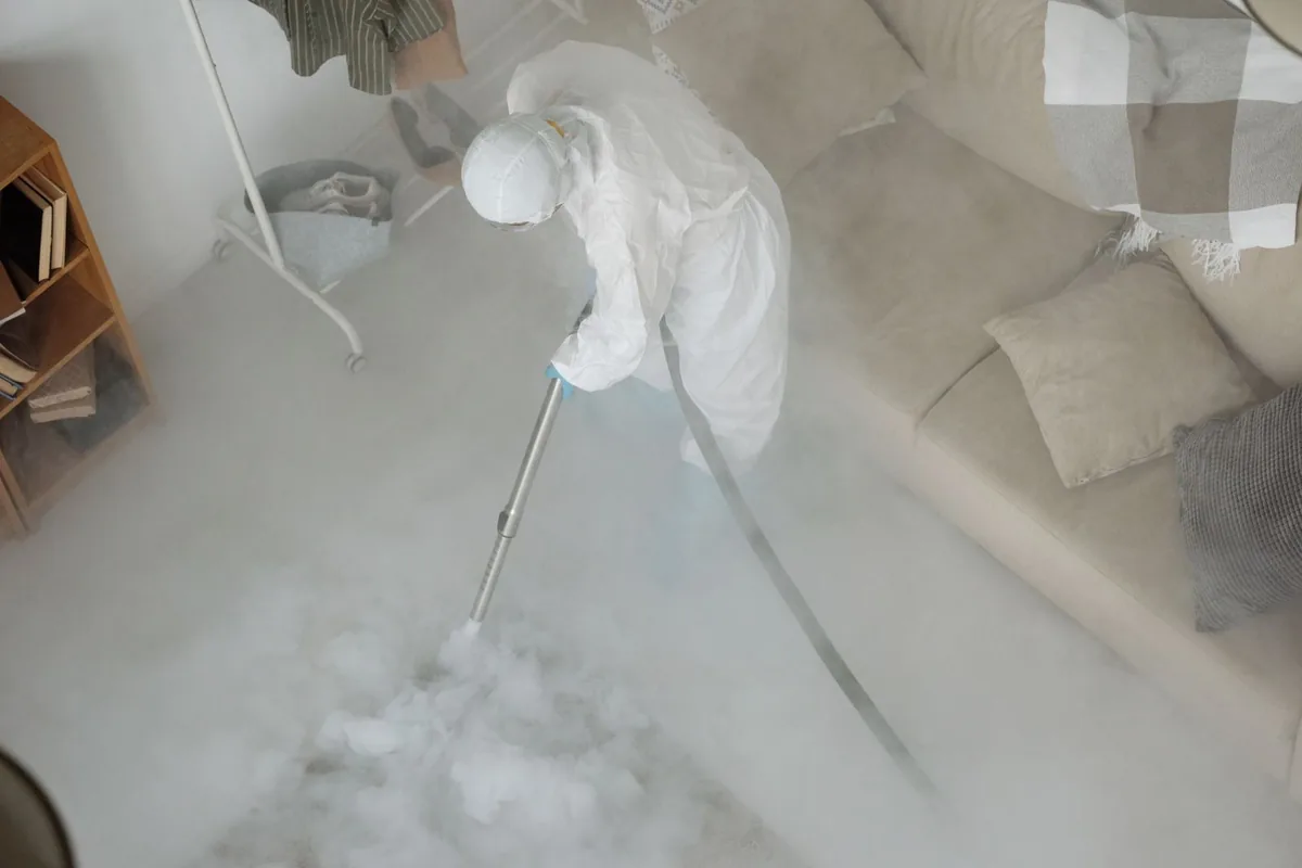 Biohazard cleanup technician in protective equipment, Morton, WA